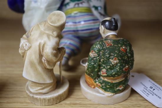 Three Japanese porcelain groups or figures